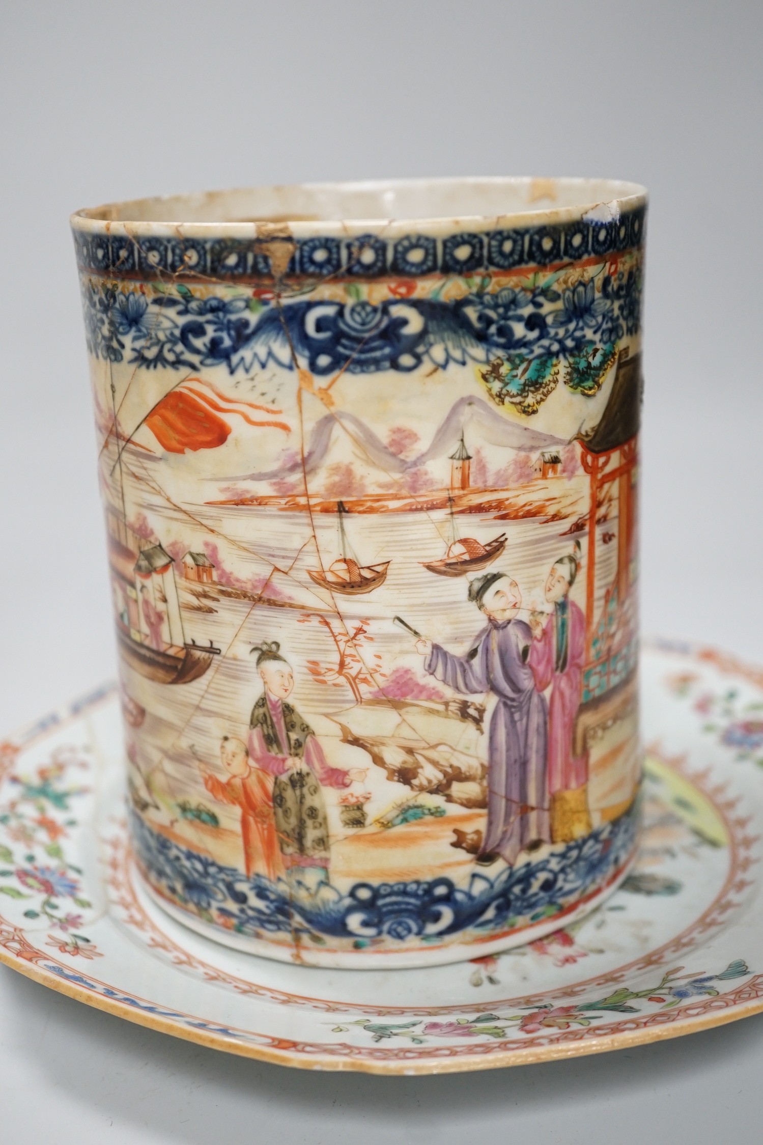 A Chinese figure of blanc de chine, a dragon tea bowl, a saucer, a large tankard, and another Chinese dish, tallest 23cm